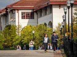 two students walking on campus.